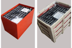 Commercial battery packed into an open slatted crate for shipping 